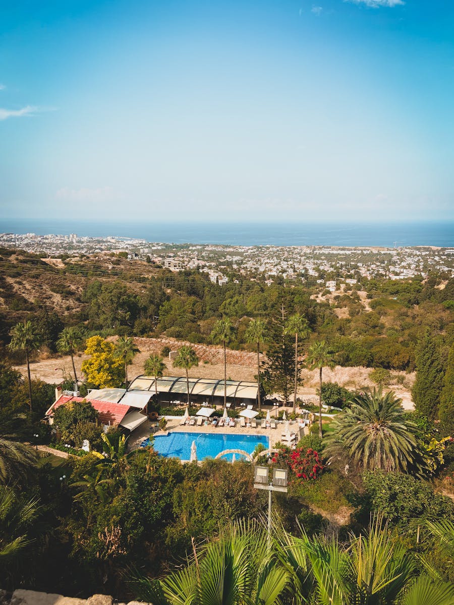 Discover the lush Kyrenia District with a pool, palms, and ocean view.